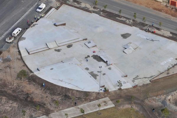 aerial view road cars round building large cement