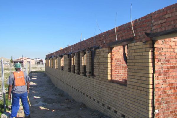 orange top brick building blue sky side view