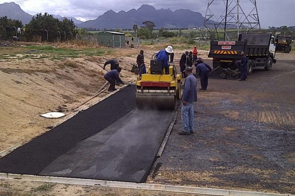 road tarring workers weight cart mountains