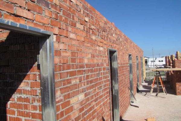 side view brick building doorway clear sky