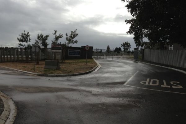 stop street left straight curve cloudy sky